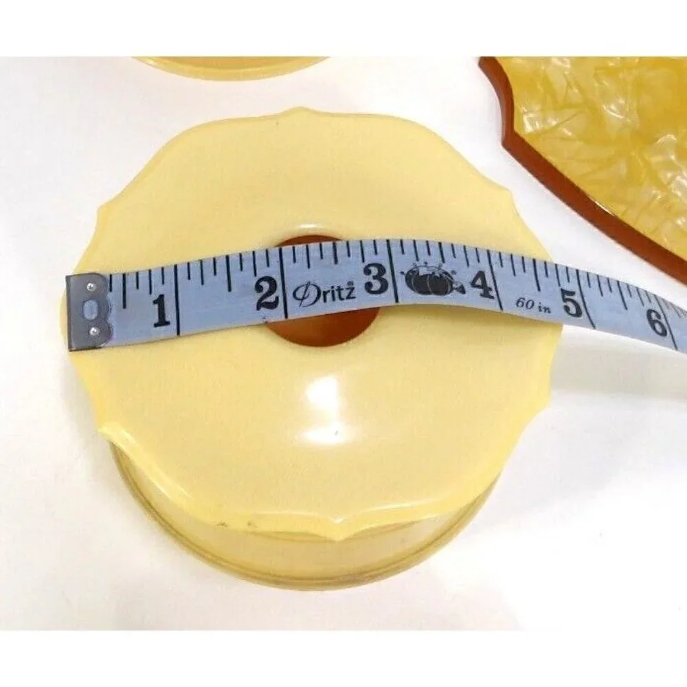 Beige celluloid hand mirror with round box, hair saver box & small bottle 1930's